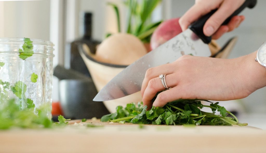 Person cutting vegetables